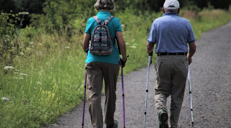 Two people walking down a path