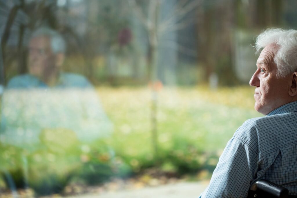 A man looking out a window