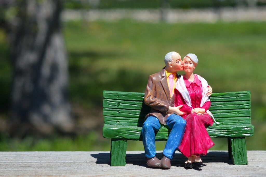 A miniature of a couple on a bench