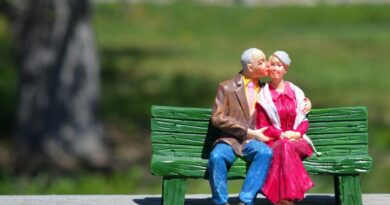 A miniature of a couple on a bench