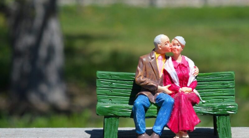 A miniature of a couple on a bench