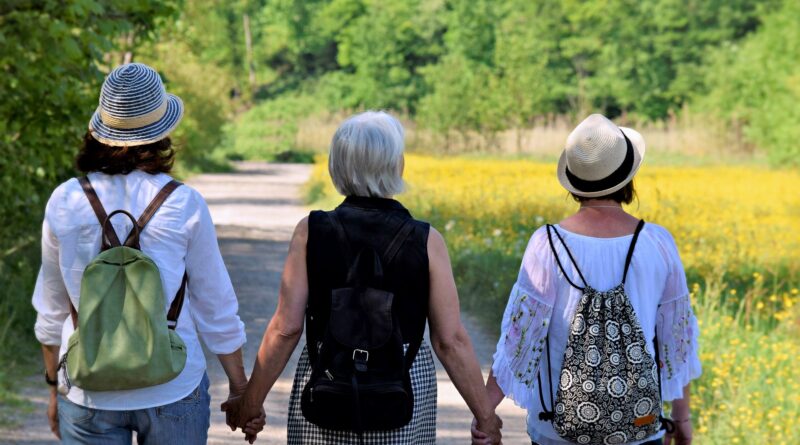 Three People Walking Down a Path