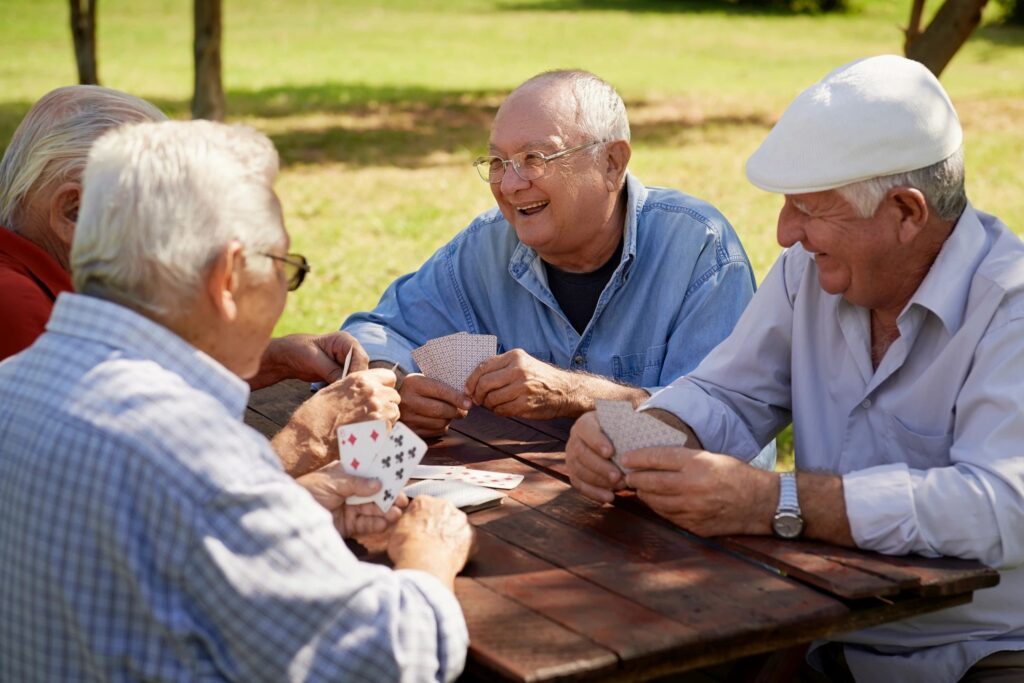 senior men playing cards