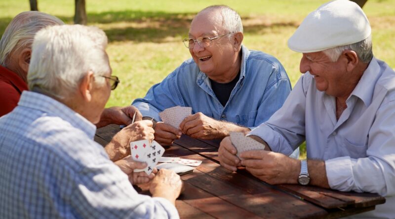 senior men playing cards