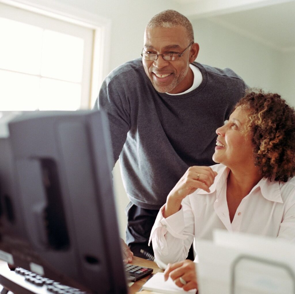 senior couple looking at computer