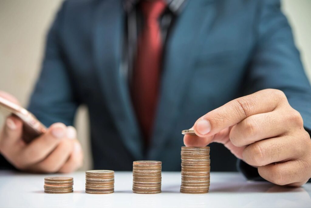 hand stacking coins