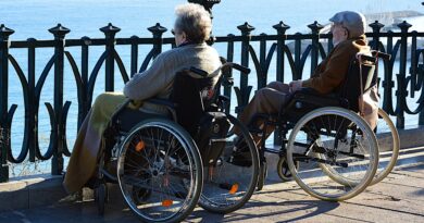 senior couple in wheelchairs