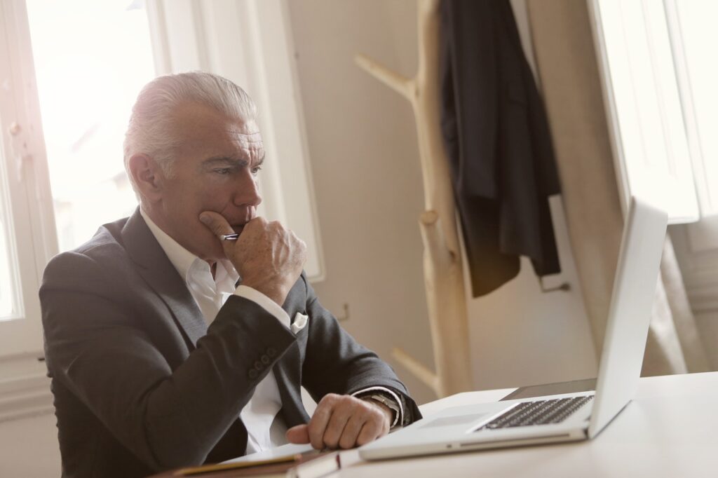 old man at laptop