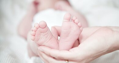 hand holding baby's feet