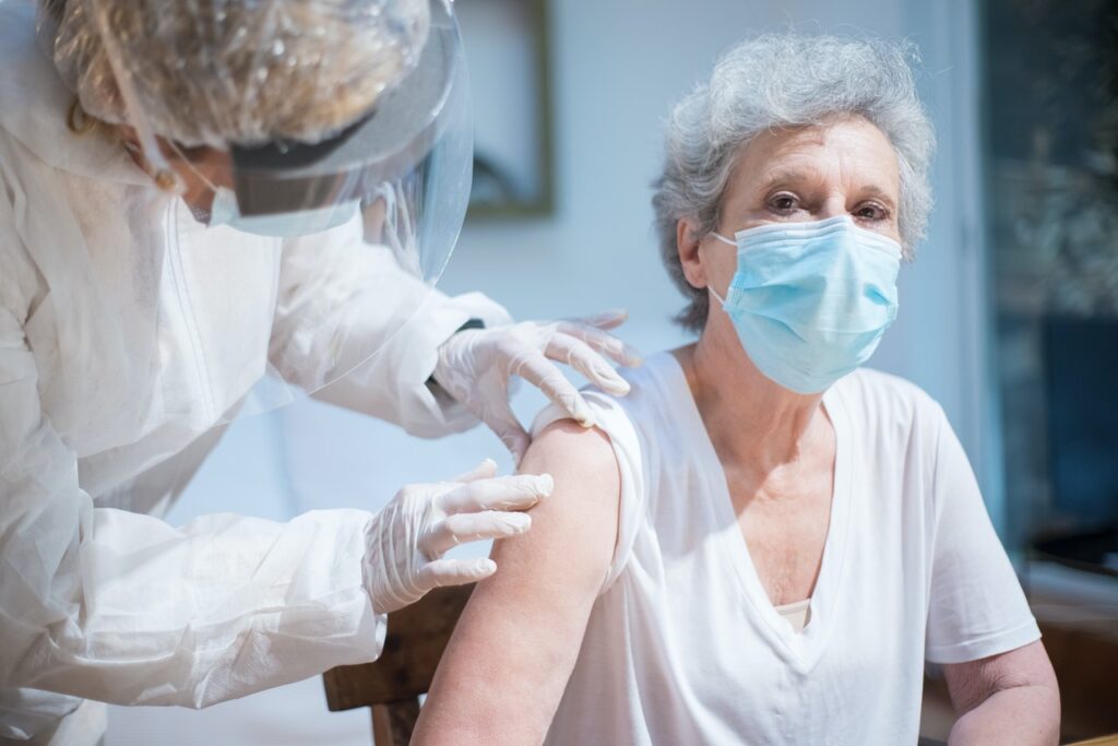 senior woman getting vaccine