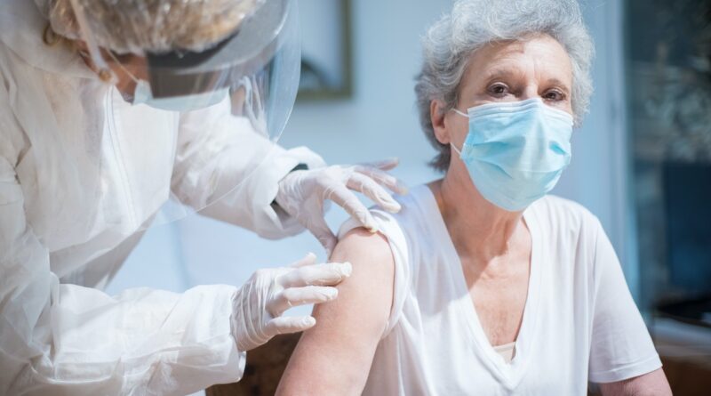senior woman getting vaccine