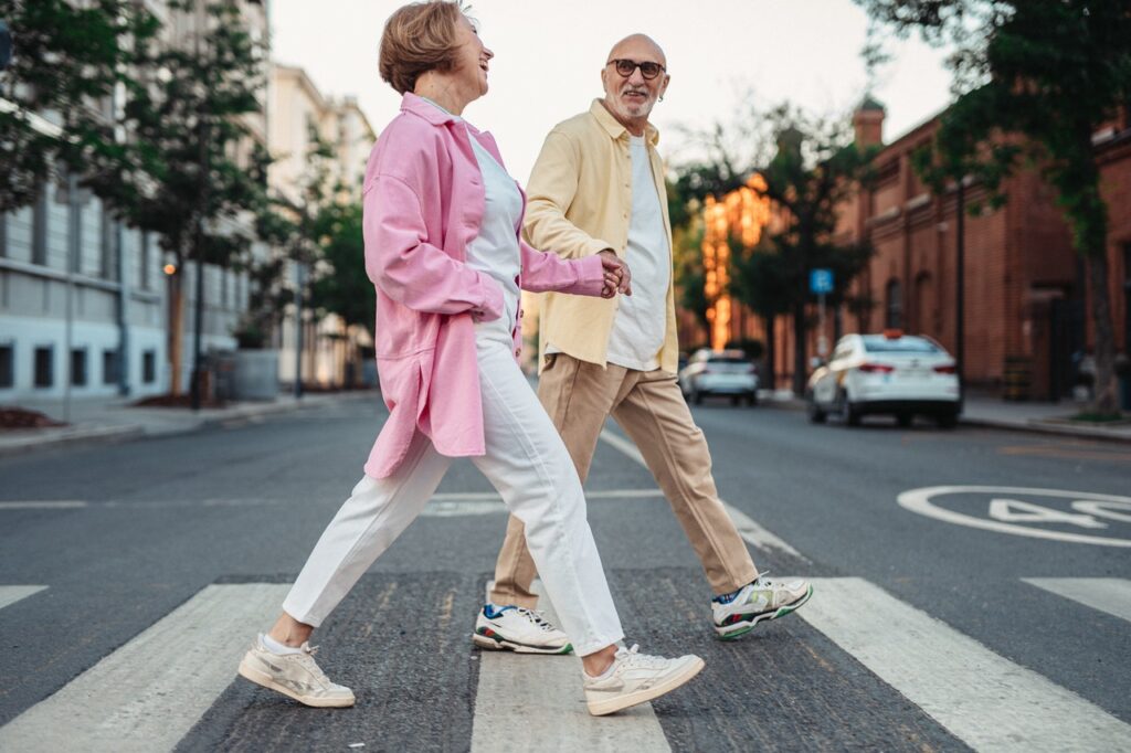 happy couple crossing street