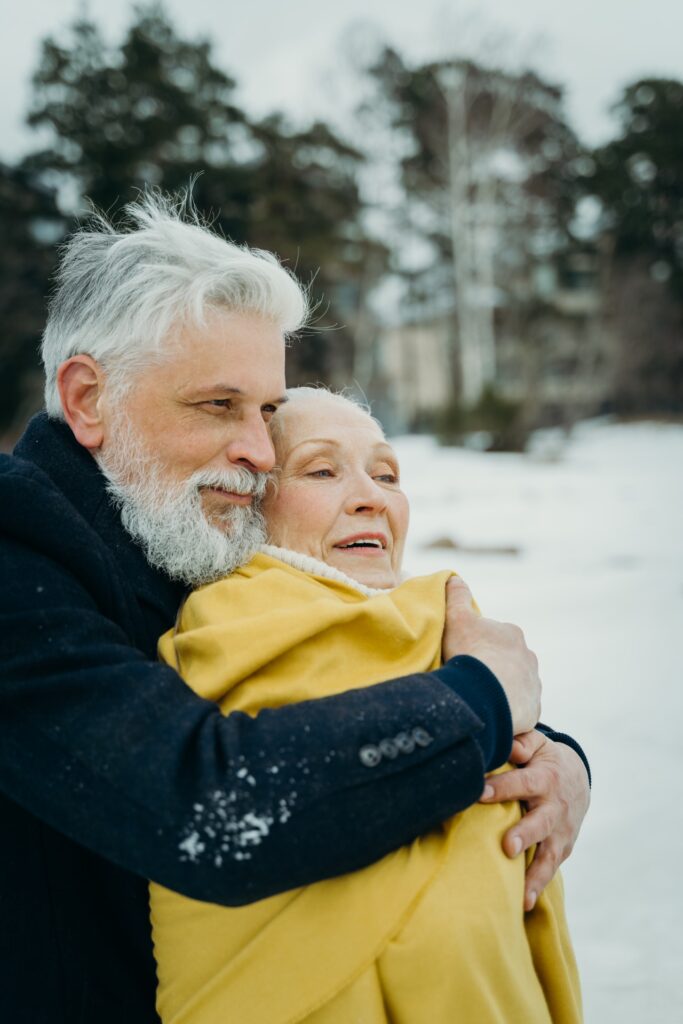 senior couple in snow