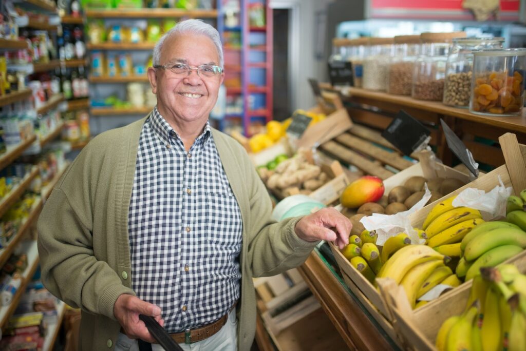 senior man grocery shopping