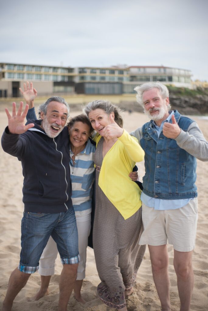 2 older couples on beach