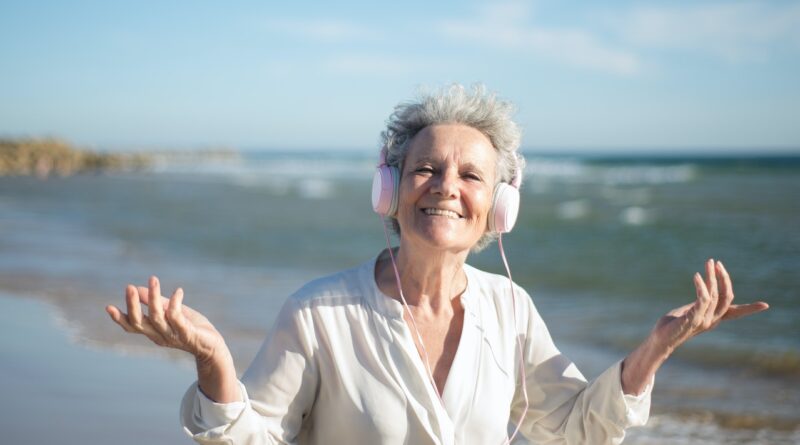 senior woman listening to headphones
