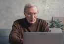 senior man watching laptop