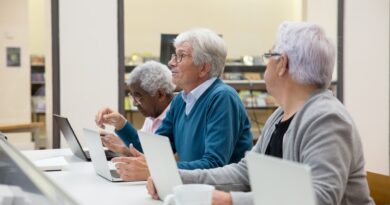 senior citizens with laptops