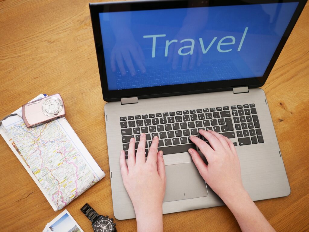 researching travel on laptop