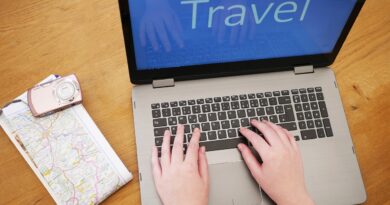 researching travel on laptop