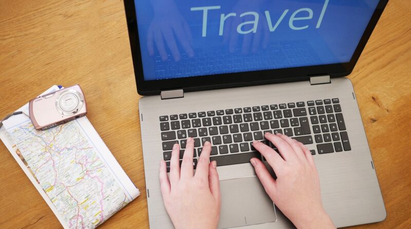researching travel on laptop