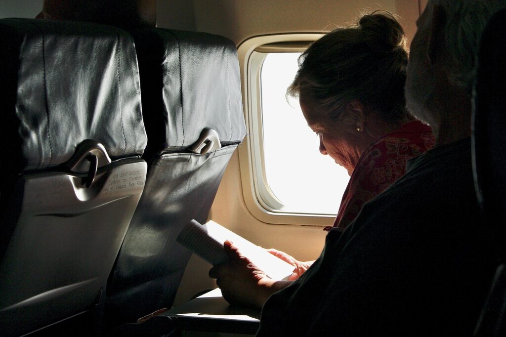 woman reading on airplane