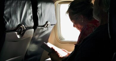 woman reading on airplane