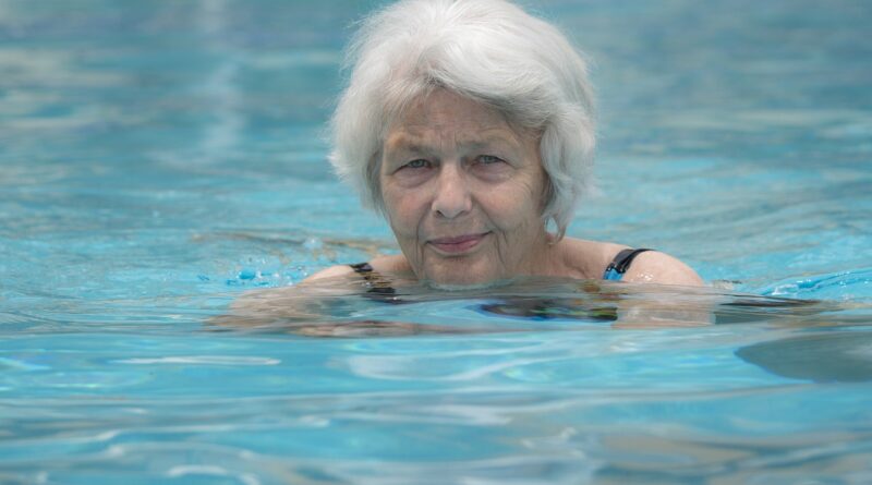 senior older woman swimming