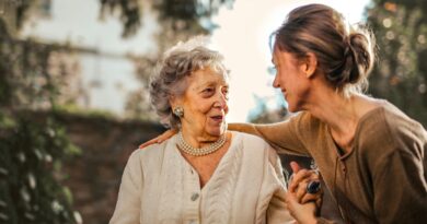 woman comforting elderly woman