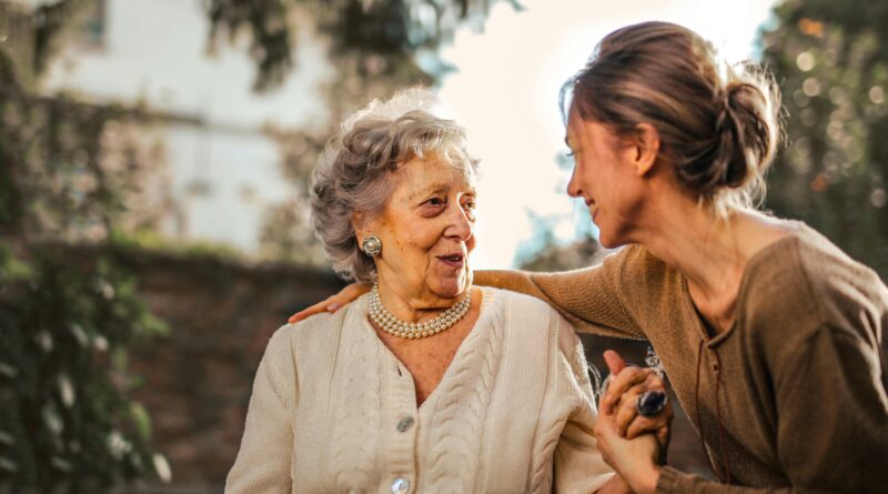 woman comforting elderly woman