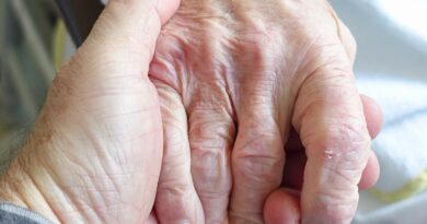 elderly holding hands