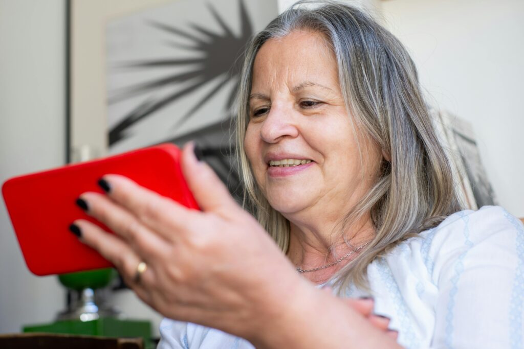senior woman holding cell phone