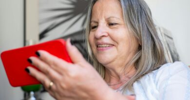 senior woman holding cell phone