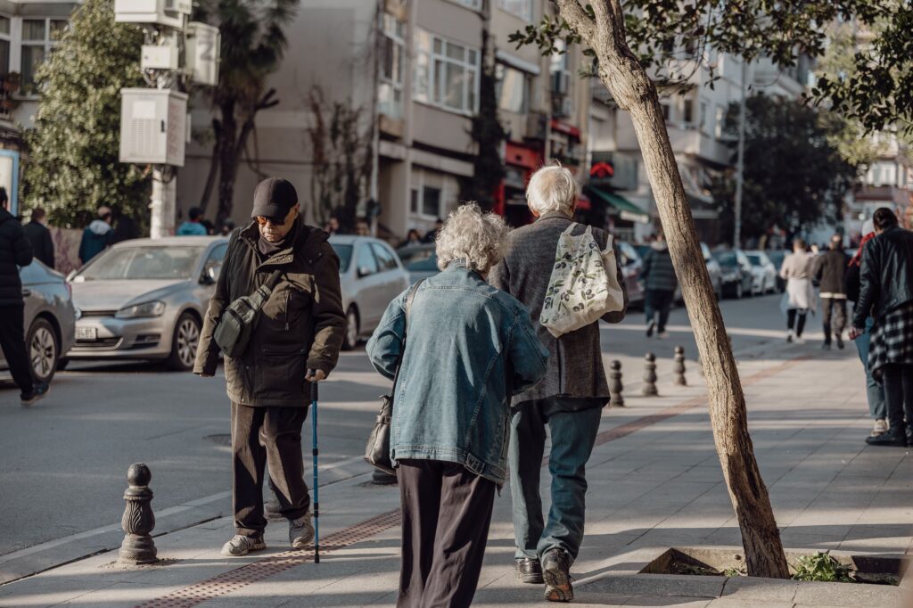 seniors walking on street in city