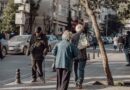 seniors walking on street in city