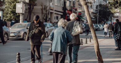 seniors walking on street in city