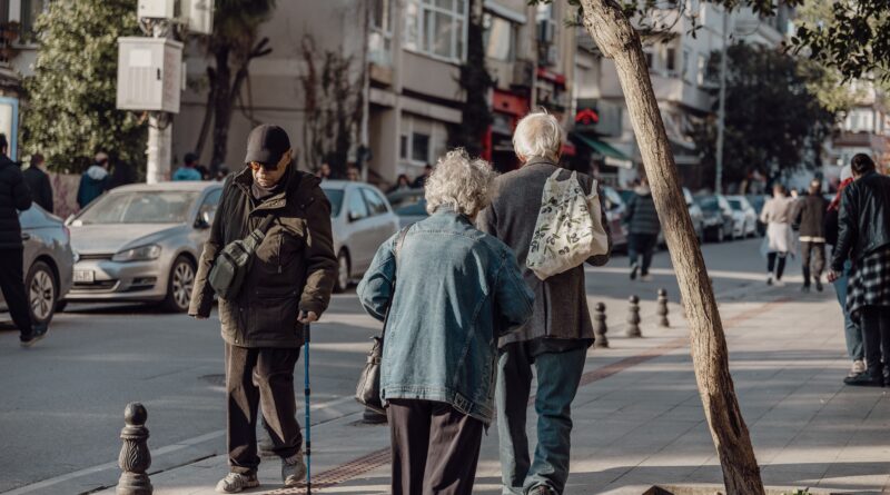 seniors walking on street in city